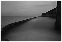 Seawall at dusk during  storm. Dry Tortugas National Park ( black and white)