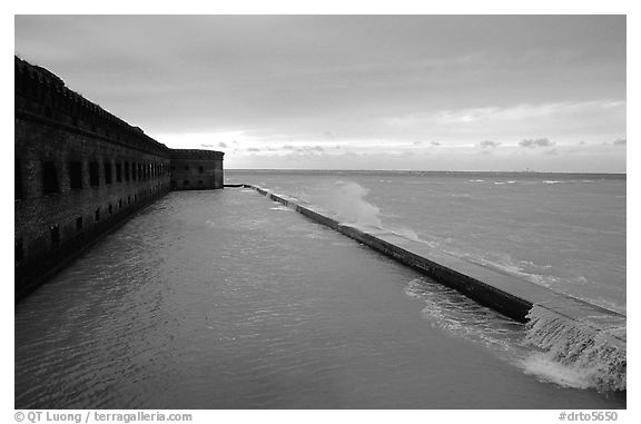 Seawall and moat with waves on stormy day. Dry Tortugas National Park, Florida, USA.