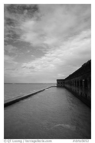 Sky, seawall and moat on windy day. Dry Tortugas National Park, Florida, USA.