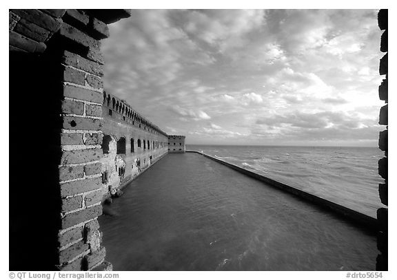 Fort Jefferson wall and moat, framed by cannon window. Dry Tortugas National Park, Florida, USA.