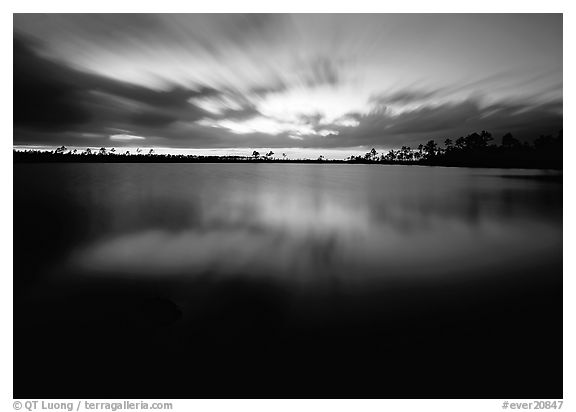 Dusk at Pine Glades Lake, with blured water and clouds. Everglades  National Park (black and white)