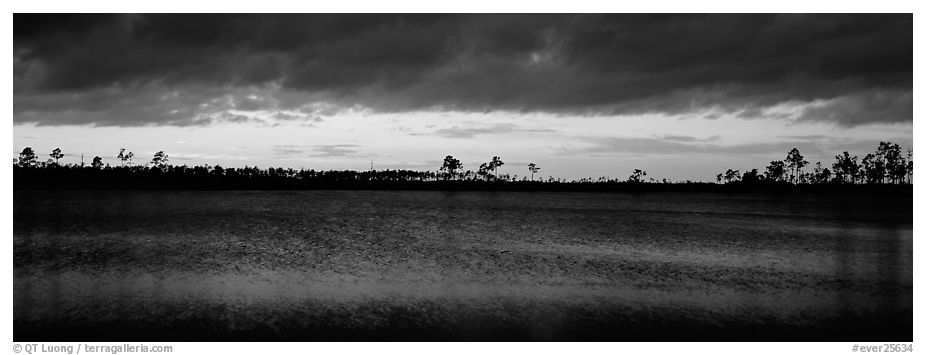 Sunset over lake with dark clouds. Everglades National Park (black and white)