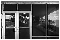 Florida Bay and lawn, Flamingo visitor center window reflexion. Everglades National Park, Florida, USA. (black and white)