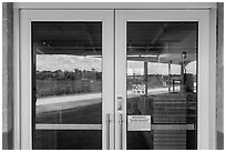 Road and slough, Shark Valley visitor center window reflexion. Everglades National Park ( black and white)