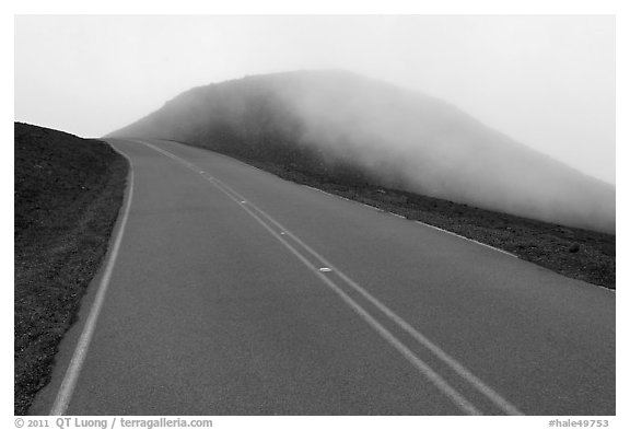Summit road in fog, Haleakala crater. Haleakala National Park, Hawaii, USA.