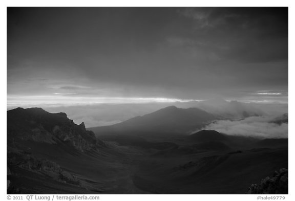 Haleakala crater and rain clouds at sunrise. Haleakala National Park, Hawaii, USA.