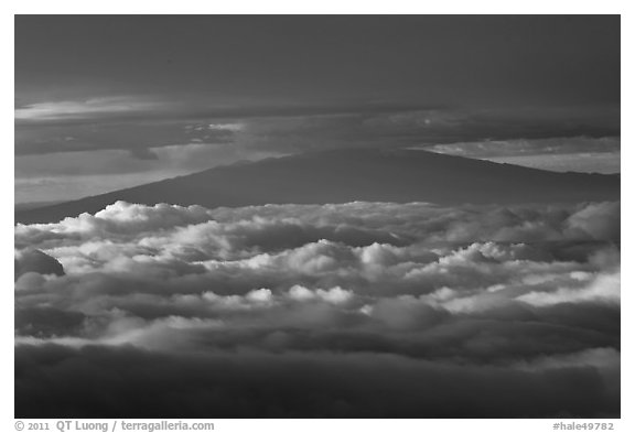 Mauna Kea between clouds, seen from Halekala summit. Haleakala National Park (black and white)