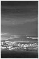 Mauna Kea above and below clouds, sunrise. Haleakala National Park ( black and white)