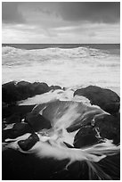 Surf, rocks, ocean and clouds. Haleakala National Park, Hawaii, USA. (black and white)