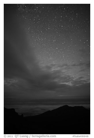 Haleakala Crater ridge and starry sky at night. Haleakala National Park, Hawaii, USA.