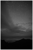 Haleakala Crater ridge and starry sky at night. Haleakala National Park, Hawaii, USA. (black and white)