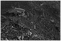 Visitor center and sunrise watchers at dawn. Haleakala National Park, Hawaii, USA. (black and white)