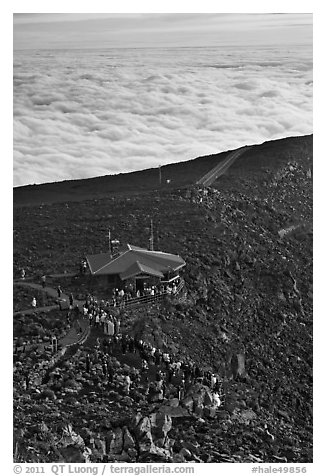 People gather to watch sunrise above sea of clouds. Haleakala National Park (black and white)