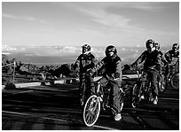 Getting ready to ride bicycles down from the top of the Crater to sea level. Haleakala National Park, Hawaii, USA. (black and white)