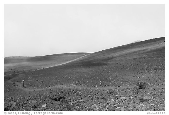 Visitor looking, Haleakala Crater in clouds. Haleakala National Park (black and white)