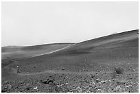 Visitor looking, Haleakala Crater in clouds. Haleakala National Park ( black and white)