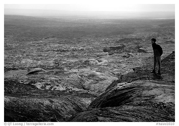 Hiker on top of Mauna Ulu crater. Hawaii Volcanoes National Park (black and white)