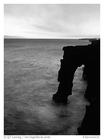 Holei sea arch at sunset. Hawaii Volcanoes National Park (black and white)