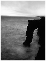 Holei sea arch at sunset. Hawaii Volcanoes National Park, Hawaii, USA. (black and white)