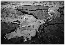 New lava flowing over layer of hardened lava. Hawaii Volcanoes National Park, Hawaii, USA. (black and white)