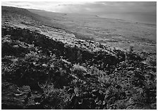 Black lava and  coastal plain from Hilana Pali. Hawaii Volcanoes National Park ( black and white)