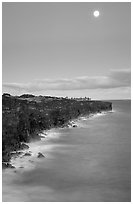 Holei Pali volcanic cliffs and moon at dusk. Hawaii Volcanoes National Park, Hawaii, USA. (black and white)