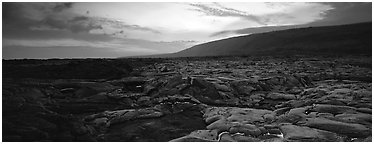 Landscape with red lava flow at sunset. Hawaii Volcanoes National Park (Panoramic black and white)