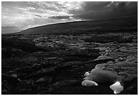 Live lava advancing at sunset. Hawaii Volcanoes National Park, Hawaii, USA. (black and white)