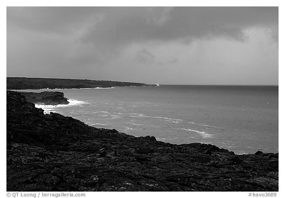 Coast covered with hardened lava and approaching storm. Hawaii Volcanoes National Park, Hawaii, USA.