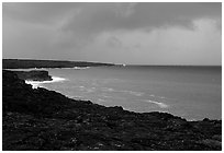 Coast covered with hardened lava and approaching storm. Hawaii Volcanoes National Park, Hawaii, USA. (black and white)