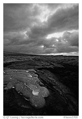 Live lava glows at dawn on coastal plain. Hawaii Volcanoes National Park (black and white)