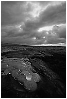 Live lava glows at dawn on coastal plain. Hawaii Volcanoes National Park, Hawaii, USA. (black and white)