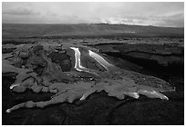 Molten lava flow at dawn on coastal plain. Hawaii Volcanoes National Park ( black and white)