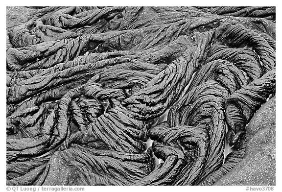 Braids of pahoehoe lava with red hot lava showing through cracks. Hawaii Volcanoes National Park, Hawaii, USA.