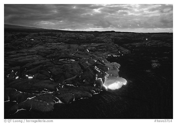 Red lava glows at dawn. Hawaii Volcanoes National Park (black and white)