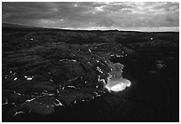 Red lava glows at dawn. Hawaii Volcanoes National Park, Hawaii, USA. (black and white)