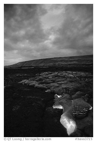 Molten Lava glows at dawn. Hawaii Volcanoes National Park (black and white)