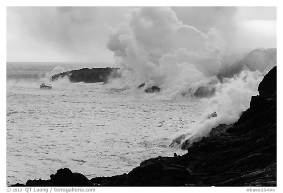 Steam rising off lava flowing into ocean. Hawaii Volcanoes National Park (black and white)