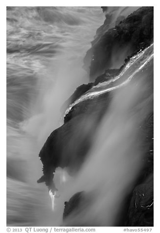 Glowing lava flow reaching the sea. Hawaii Volcanoes National Park (black and white)