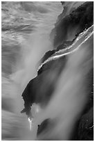 Glowing lava flow reaching the sea. Hawaii Volcanoes National Park, Hawaii, USA. (black and white)