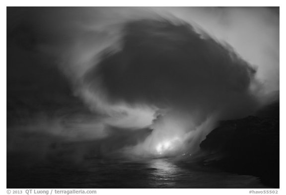 Lava steam swirls above ocean at dusk. Hawaii Volcanoes National Park, Hawaii, USA.