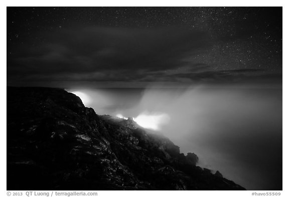 Lava makes contact with ocean on a stary night. Hawaii Volcanoes National Park (black and white)