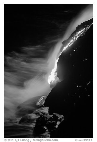 Lava flow entering Pacific Ocean at night. Hawaii Volcanoes National Park (black and white)