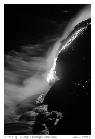 Lava flow entering Pacific Ocean at night. Hawaii Volcanoes National Park (black and white)