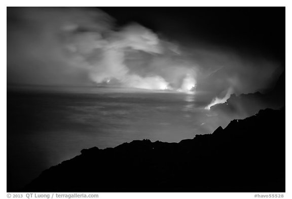 Hydrochloric steam clouds glow by lava light on coast. Hawaii Volcanoes National Park (black and white)