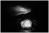 Tent and lava ocean entry. Hawaii Volcanoes National Park, Hawaii, USA. (black and white)