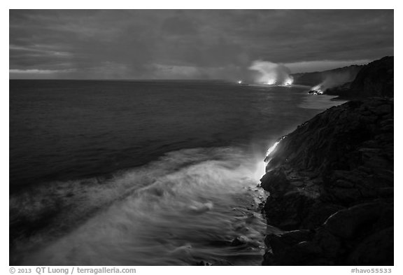 Lava reaching ocean at dawn. Hawaii Volcanoes National Park, Hawaii, USA.