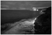 Lava reaching ocean at dawn. Hawaii Volcanoes National Park, Hawaii, USA. (black and white)