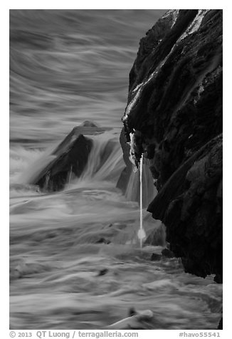 Hot lava drips into ocean waters at dawn. Hawaii Volcanoes National Park, Hawaii, USA.