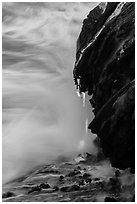 Molten lava drips into the sea. Hawaii Volcanoes National Park ( black and white)